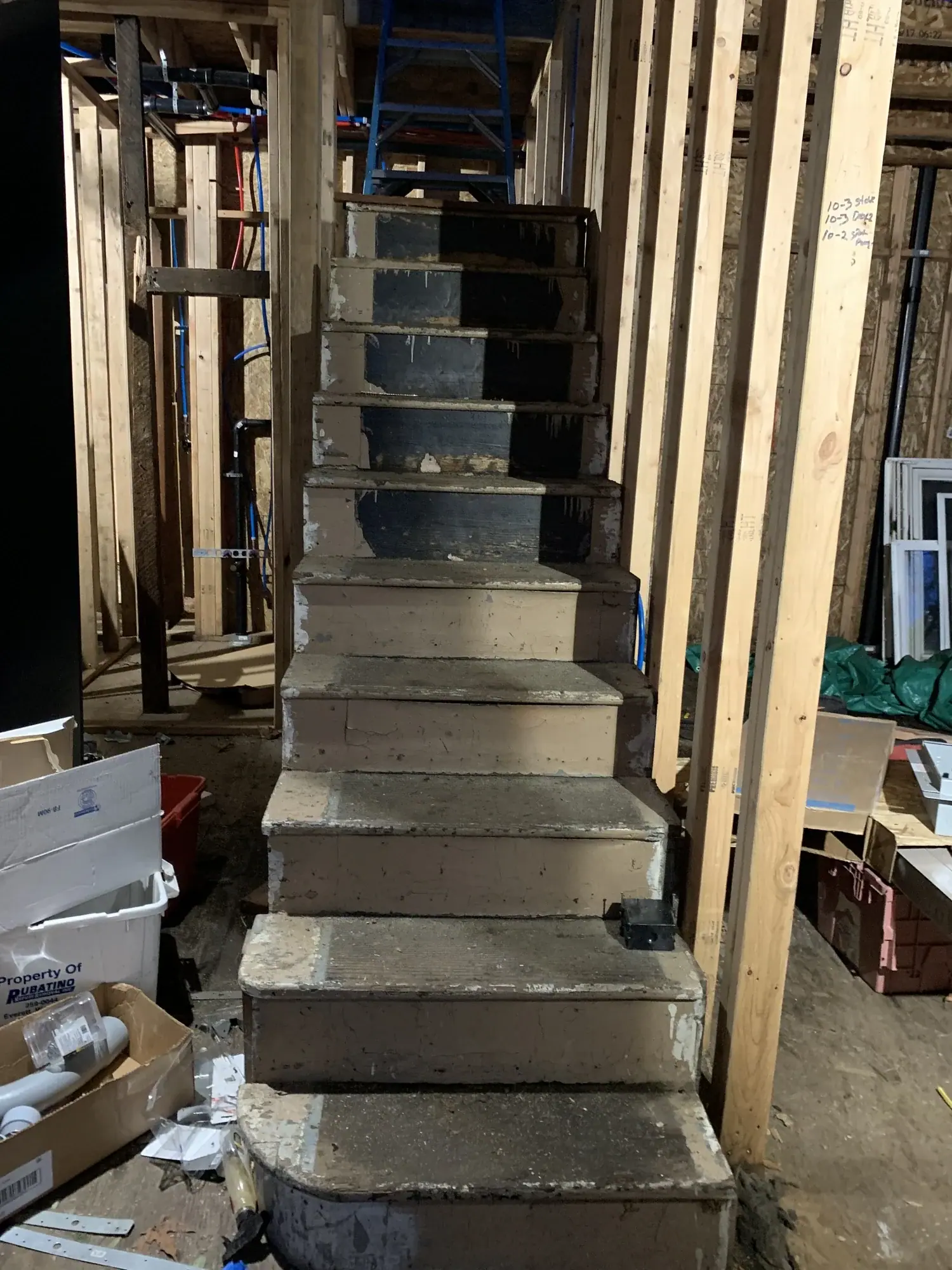 Concrete stair under construction inside the new framing
