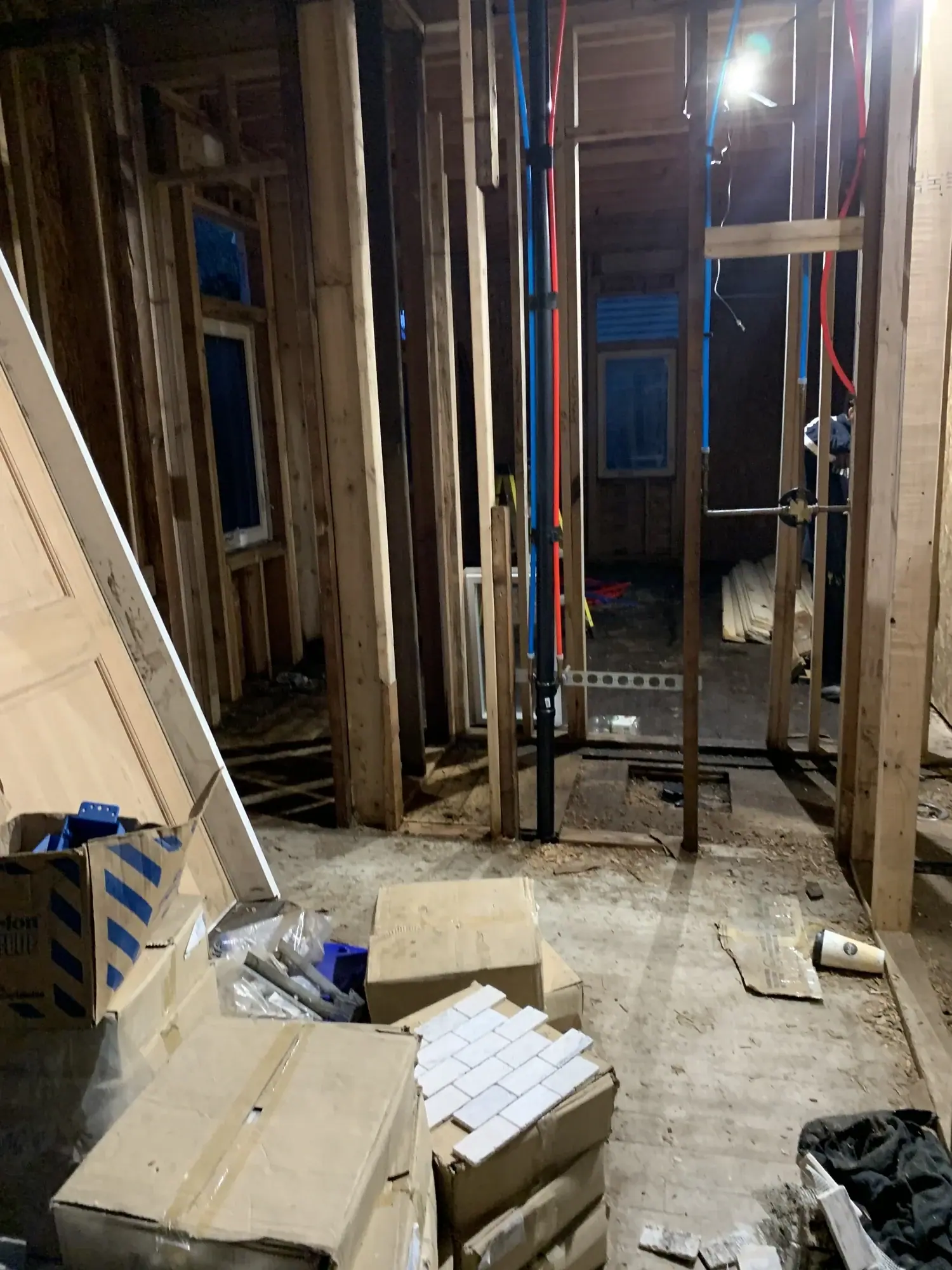 Interior wall framing with plumbing rough-in on the main level