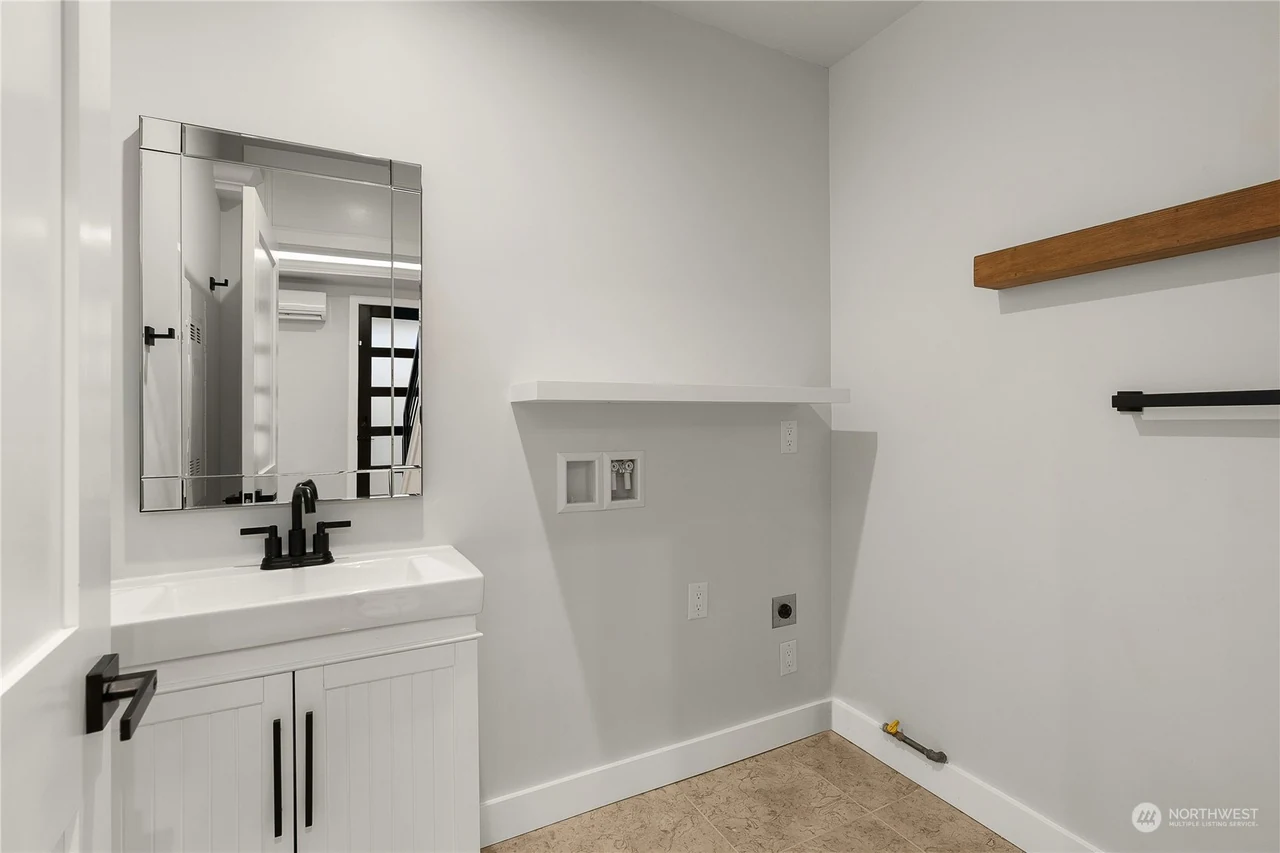 Laundry and bath with a vanity and washer hookups