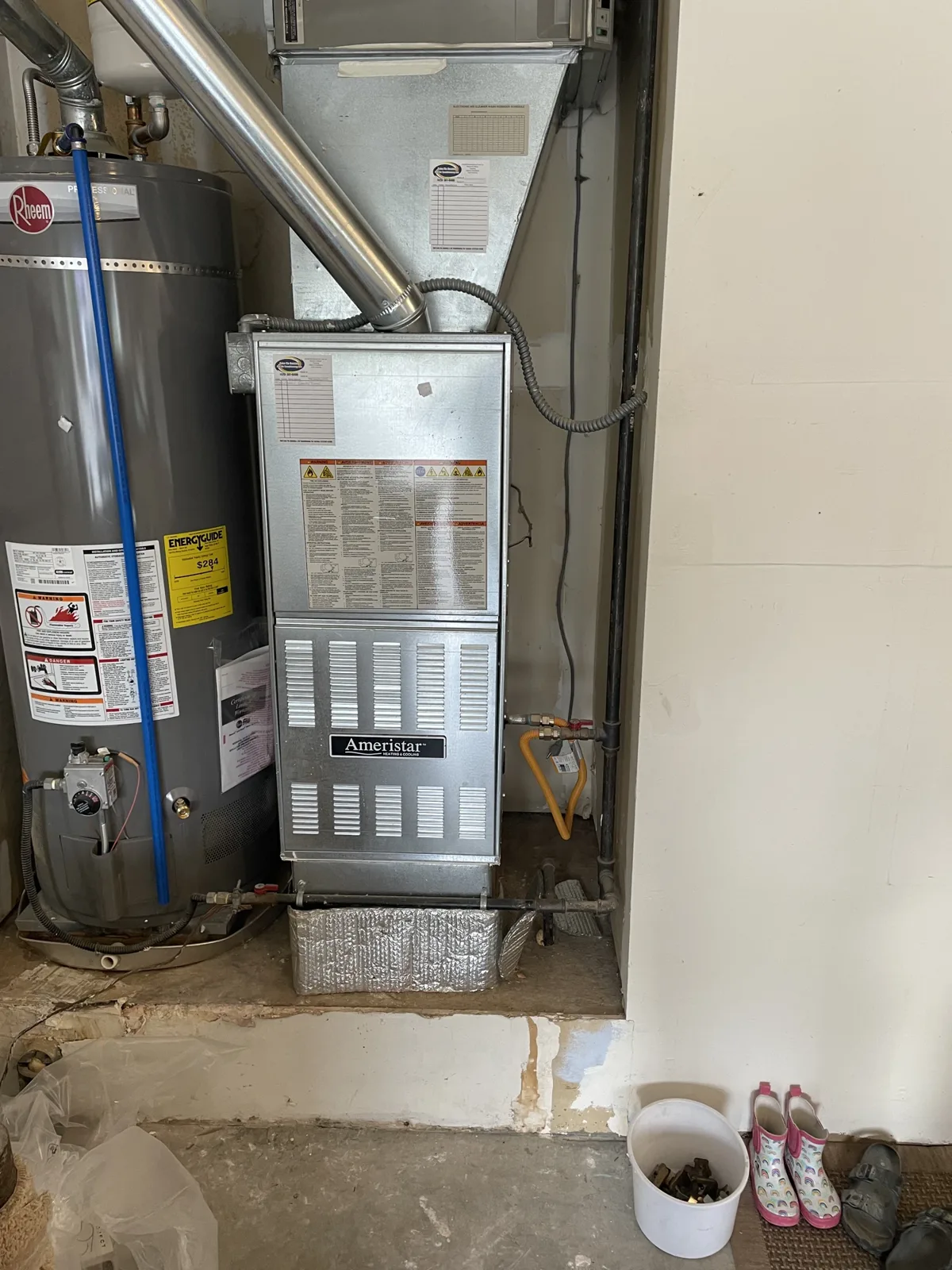 High-efficiency furnace and water heater installed in the mechanical room