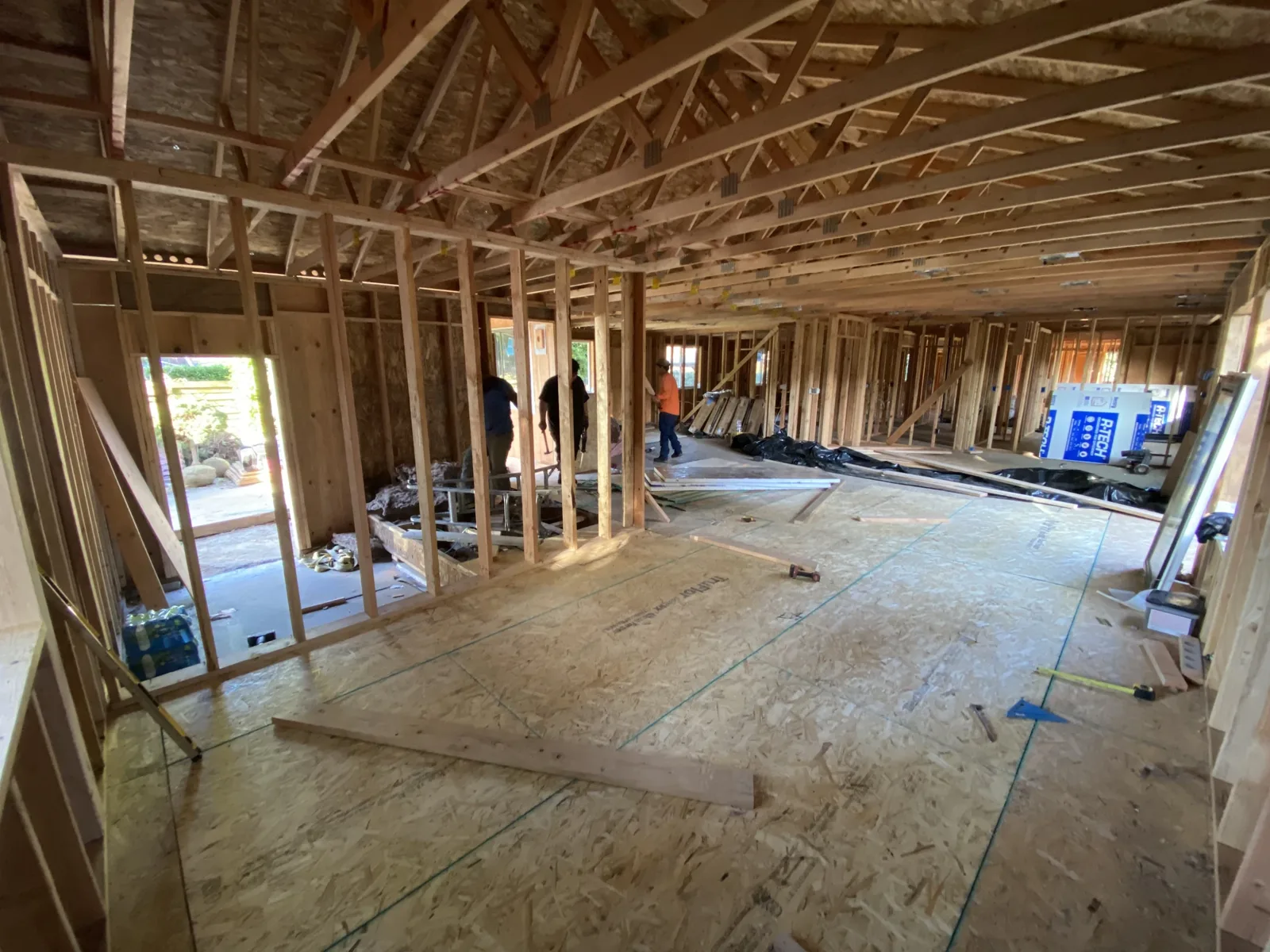 Interior view of roof trusses spanning the framed walls