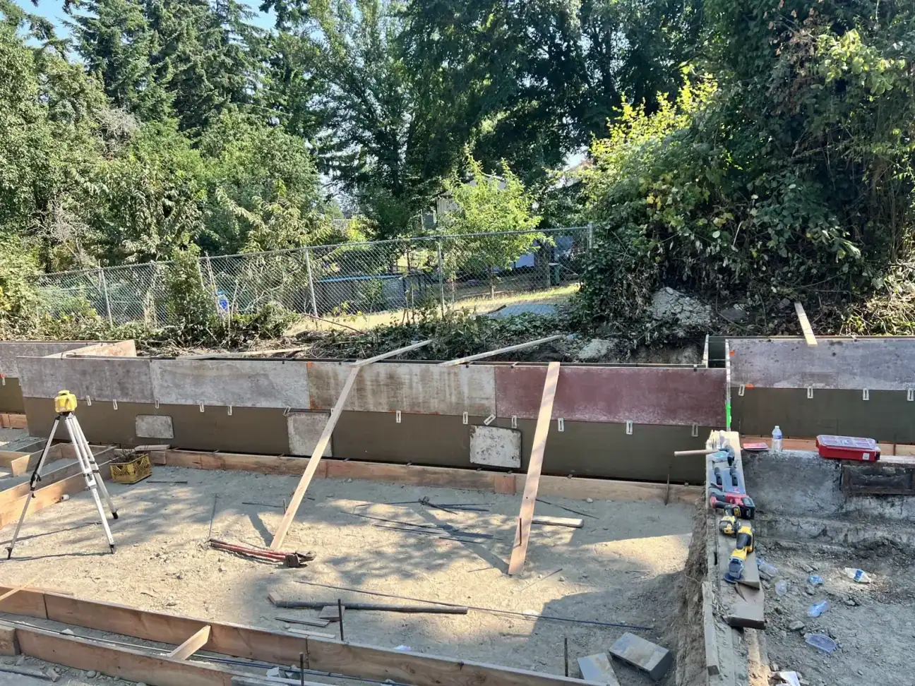 Formed concrete foundation walls braced and ready for the pour