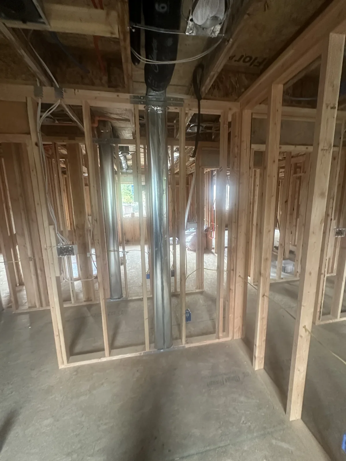 HVAC duct dropping through the framing during mechanical rough-in