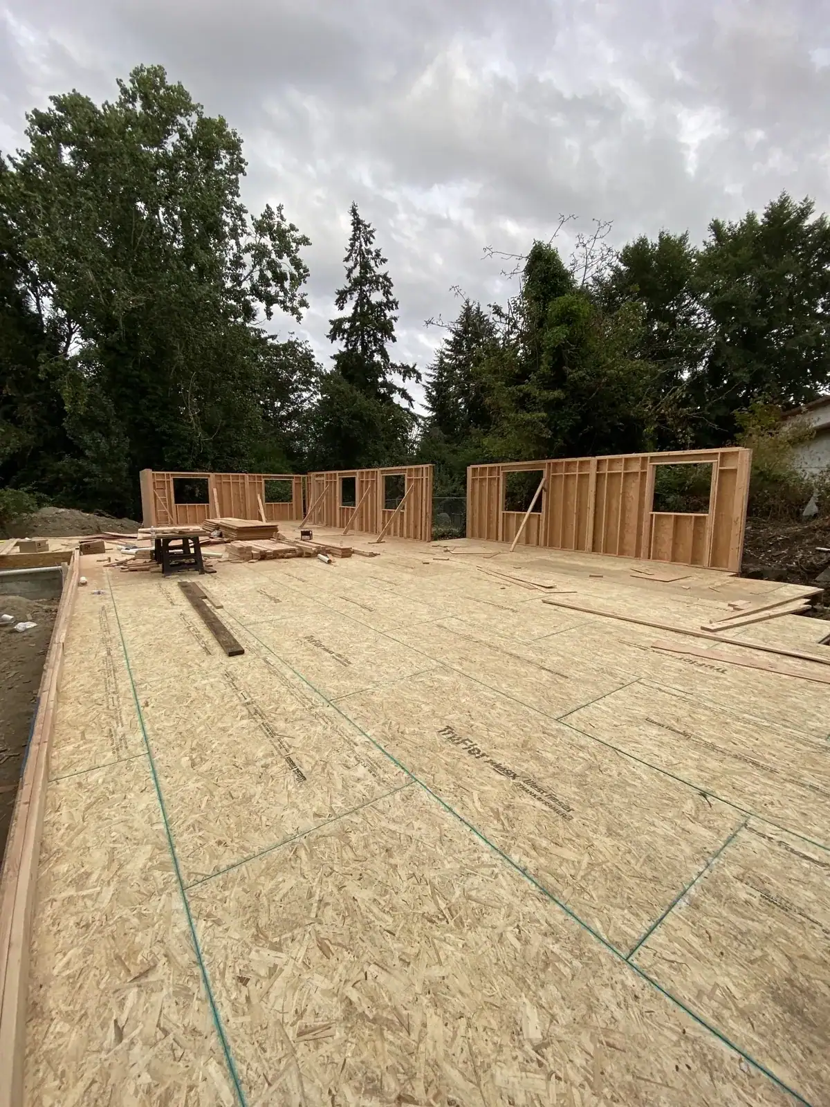 Sheathed subfloor with the first framed walls going up