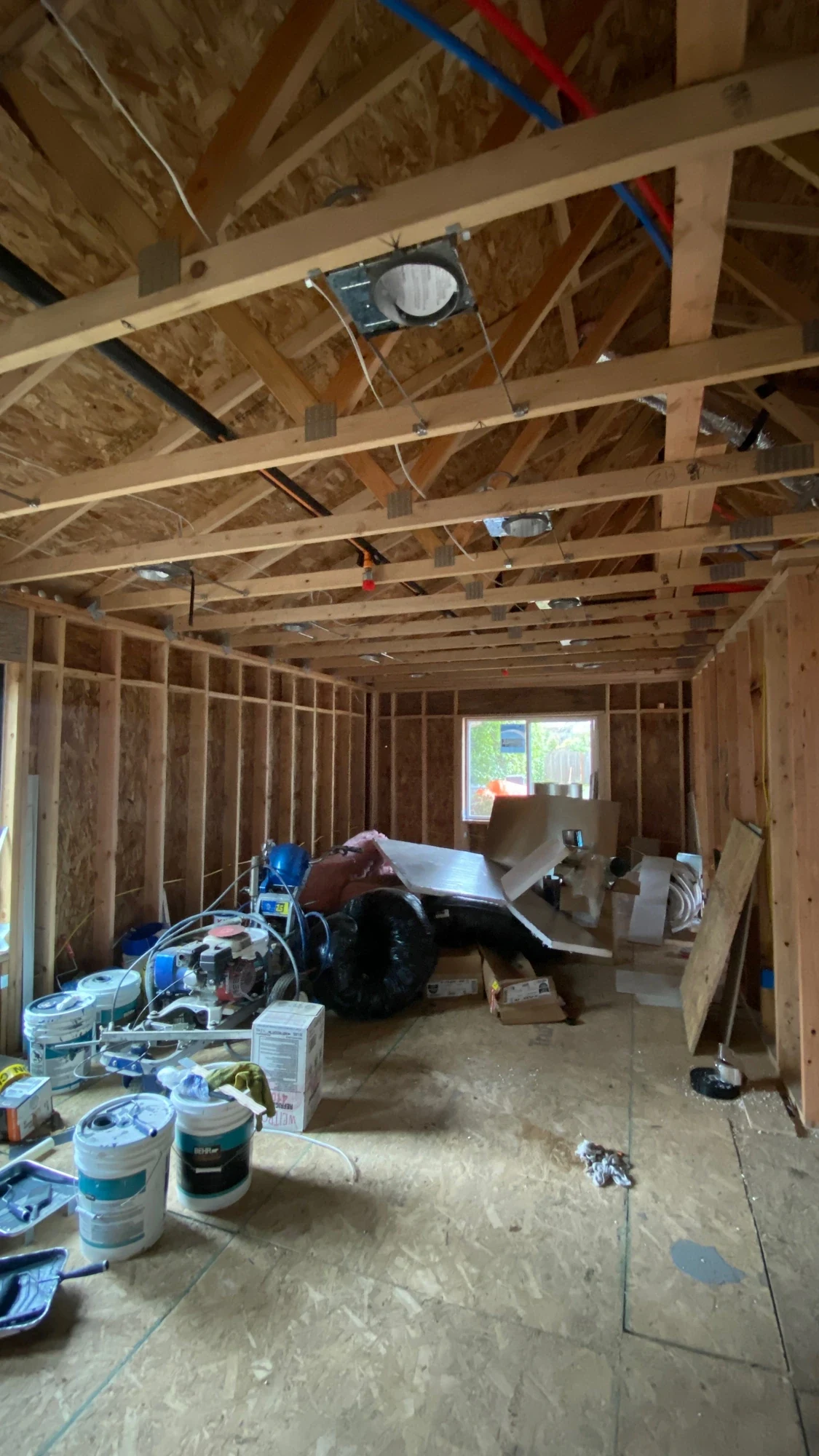 Electrical rough-in boxes and wiring through the DADU wall framing under the trusses