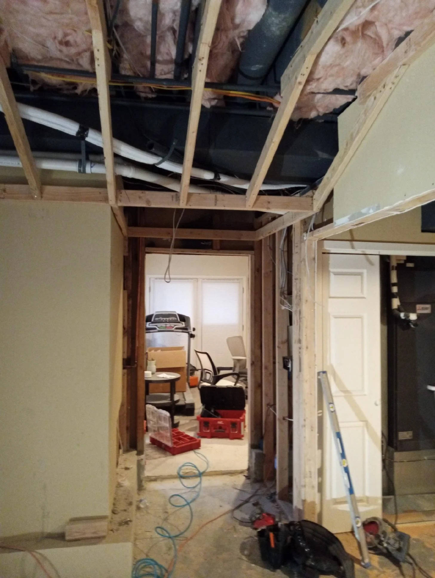 New ceiling framing and ductwork around the doorway to the upper floor